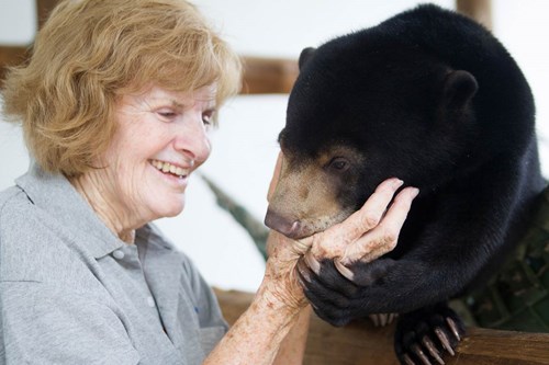 Mary Hutton and Maggie, a rescued sun bear cub