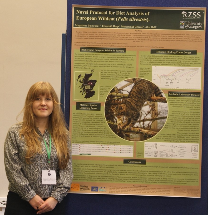 Magda posing next to research poster